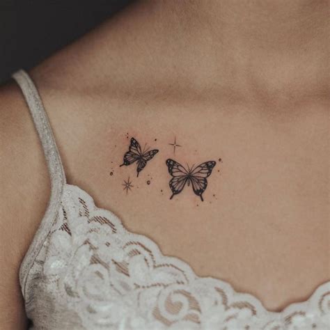 collar bone small butterfly tattoo on chest|15 Small Butterfly Tattoo Designs for the Chest